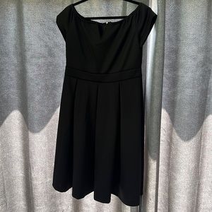 Black below knee length party dress, size large (16) . Brand new with tags.